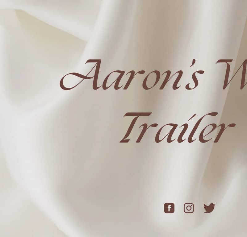 A white sheet with the words aaron 's war trailer written in brown.